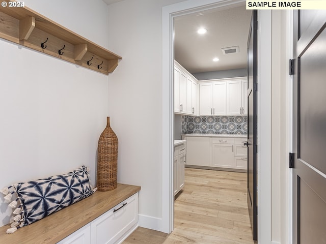 mudroom with light wood-type flooring