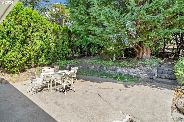 view of patio featuring outdoor dining area