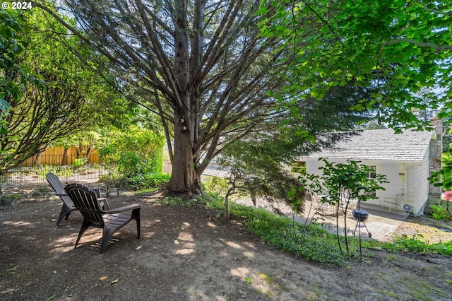 view of yard with a patio and fence