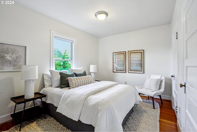 bedroom featuring dark hardwood / wood-style flooring