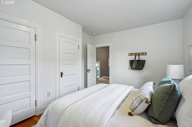 bedroom featuring dark wood-type flooring