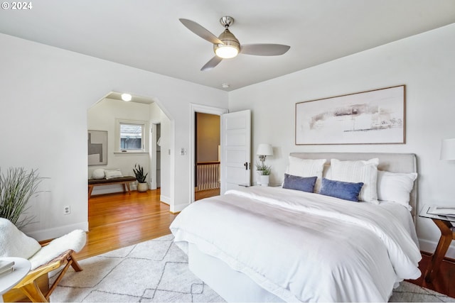 bedroom with ceiling fan and light hardwood / wood-style flooring