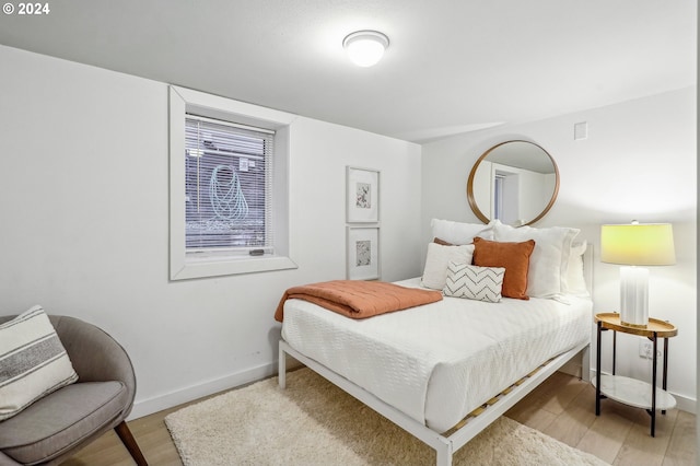 bedroom with light hardwood / wood-style flooring