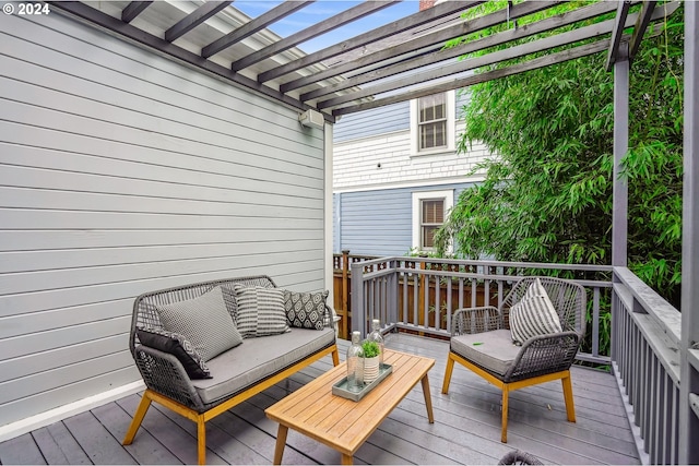 deck with a pergola and an outdoor hangout area