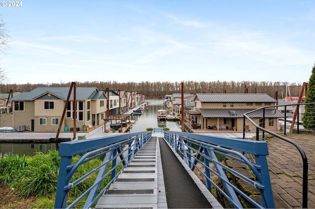 view of dock with a water view and cooling unit