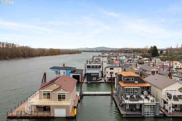 view of dock featuring a water and mountain view