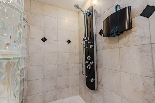 bathroom with a tile shower