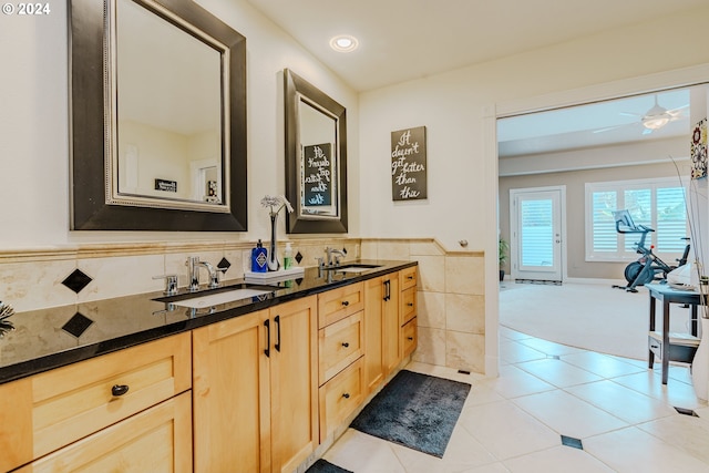 bathroom featuring vanity, ceiling fan, tile patterned flooring, and tile walls