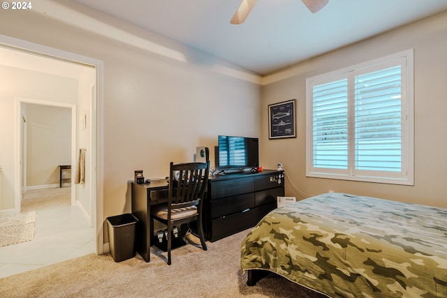 bedroom featuring light colored carpet and ceiling fan