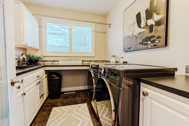 washroom with sink, cabinets, and independent washer and dryer