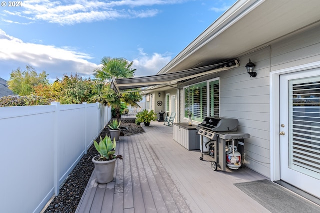 deck featuring a grill