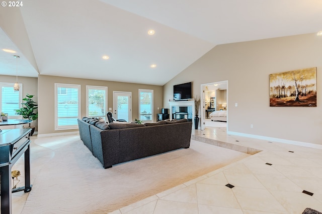 tiled living room with high vaulted ceiling