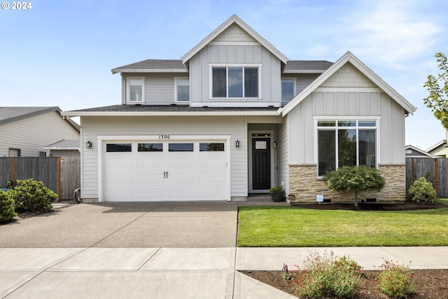 view of front of house featuring a front yard and a garage