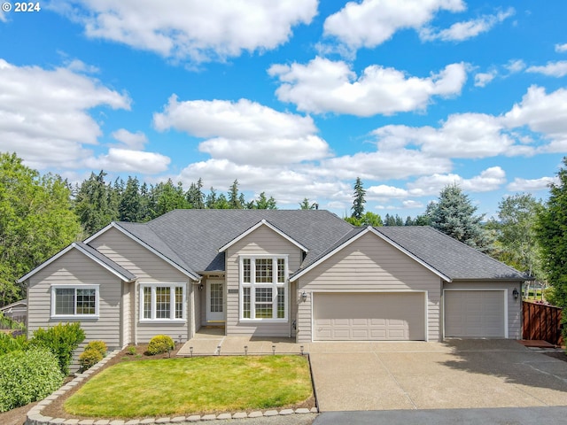 single story home featuring a front yard and a garage