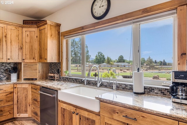 6150 NW Kingwood Ave, Redmond, OR 97756 - kitchen featuring a sink, backsplash, light stone countertops, and dishwasher