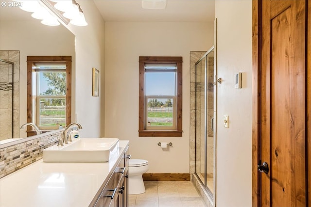 6150 NW Kingwood Ave, Redmond, OR 97756 - full bathroom featuring a stall shower, healthy amount of natural light, and toilet