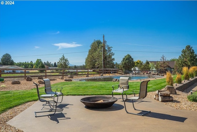 6150 NW Kingwood Ave, Redmond, OR 97756 - view of patio featuring a fire pit and an outdoor pool