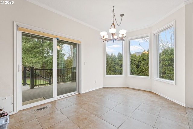 unfurnished dining area featuring crown molding, light tile patterned flooring, and a chandelier