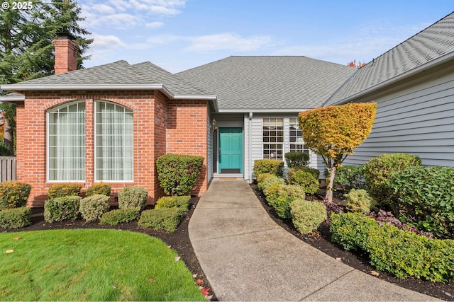 entrance to property with a yard