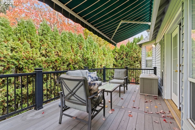 wooden terrace featuring an outdoor living space