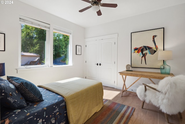 bedroom with ceiling fan and hardwood / wood-style flooring