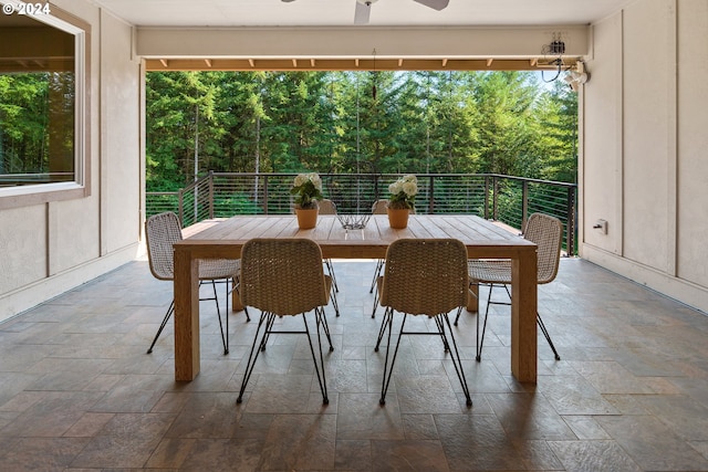 interior space featuring ceiling fan and a balcony