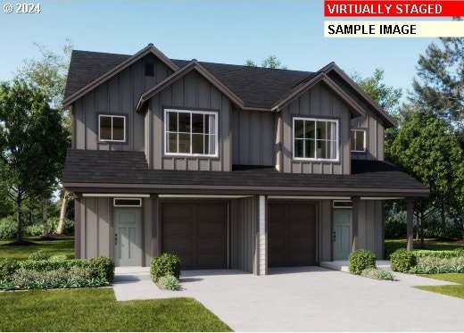 view of front of house featuring a front yard and a garage