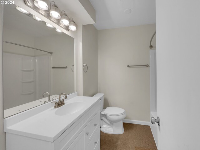 full bathroom featuring vanity, shower / washtub combination, and toilet