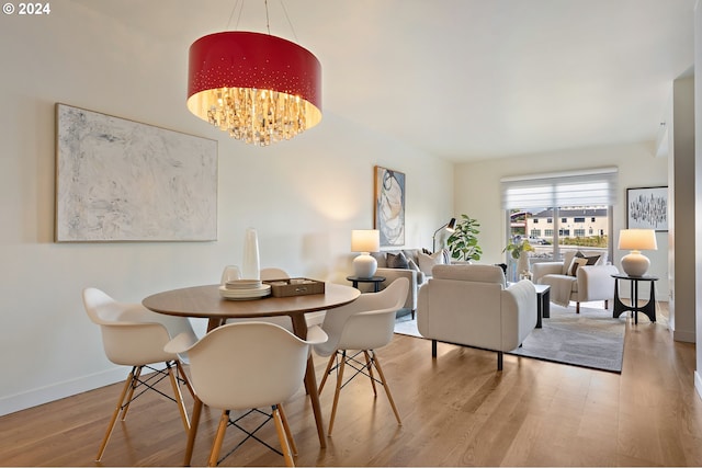 dining room featuring a notable chandelier and hardwood / wood-style floors