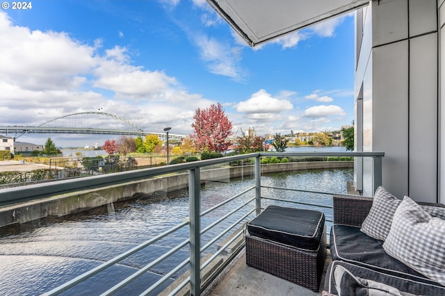 balcony featuring a water view