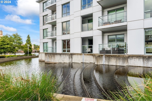 view of property with a water view