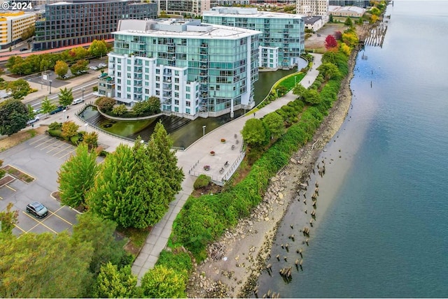 birds eye view of property with a water view