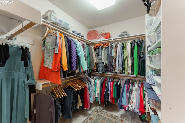 spacious closet featuring light tile patterned floors