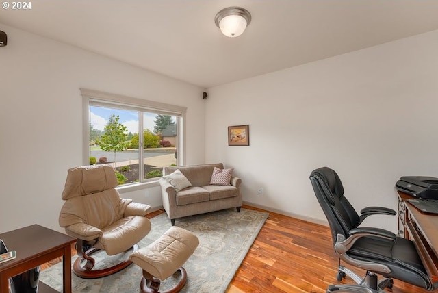 office with light hardwood / wood-style floors