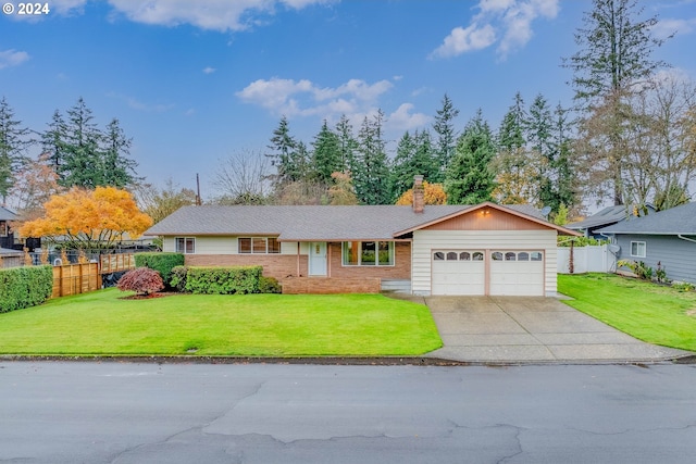 single story home with a front yard and a garage