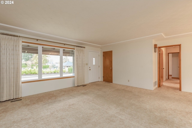 empty room featuring light carpet