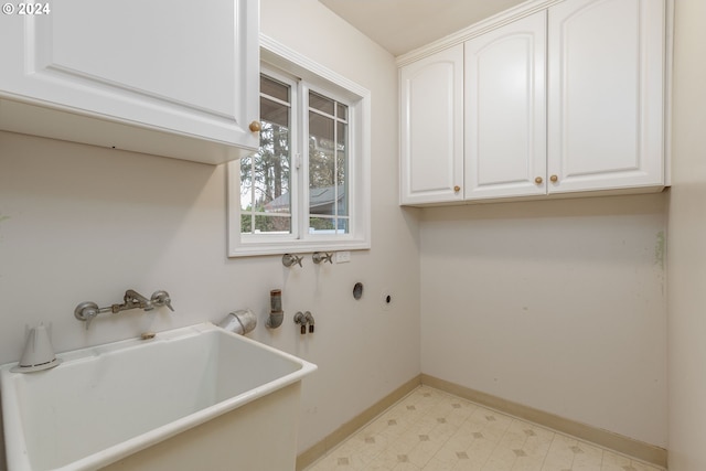 laundry area with sink and cabinets