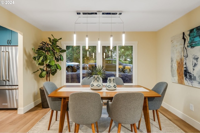 dining space featuring light hardwood / wood-style flooring