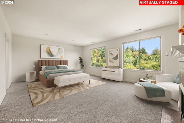 bedroom featuring light colored carpet