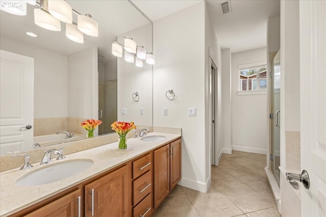 bathroom with tile patterned floors, vanity, and plus walk in shower