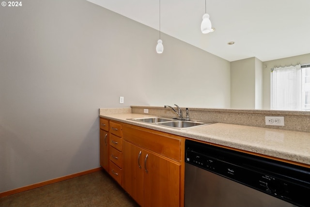 kitchen featuring hanging light fixtures, sink, dishwasher, and dark carpet