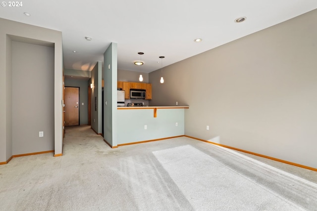 unfurnished living room with light carpet