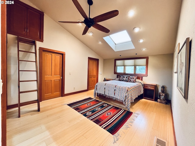 242 Rocky Point Ln, Roseburg, OR 97471 - bedroom with a skylight, light wood finished floors, vaulted ceiling, and recessed lighting