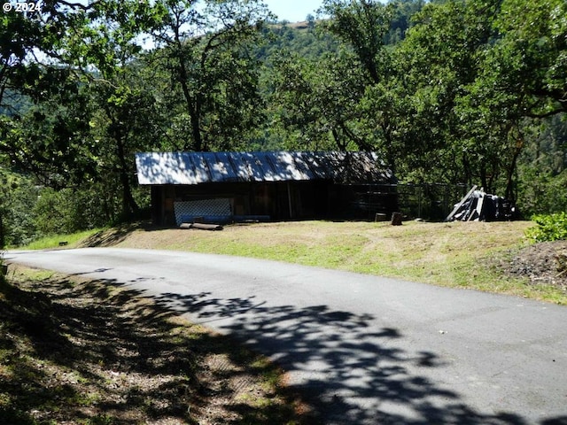 242 Rocky Point Ln, Roseburg, OR 97471 - view of asphalt street with a view of trees