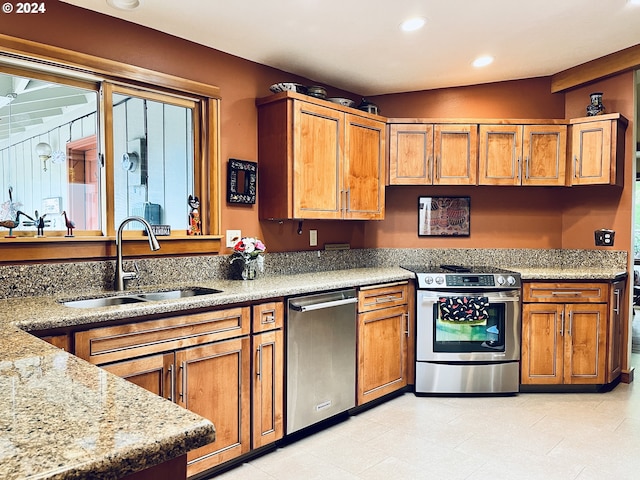 242 Rocky Point Ln, Roseburg, OR 97471 - kitchen with appliances with stainless steel finishes, brown cabinets, recessed lighting, and light stone counters