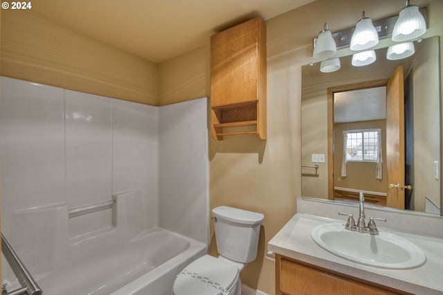 full bathroom with vanity, washtub / shower combination, and toilet