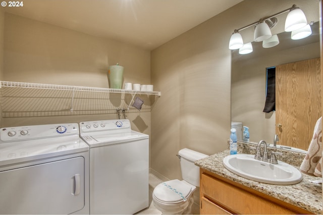 washroom featuring independent washer and dryer and sink