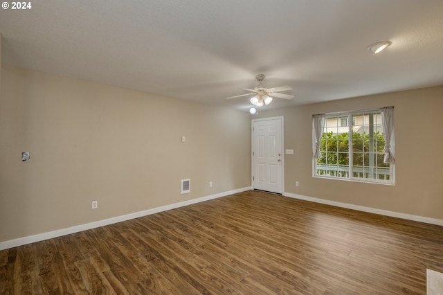 spare room featuring ceiling fan and hardwood / wood-style floors