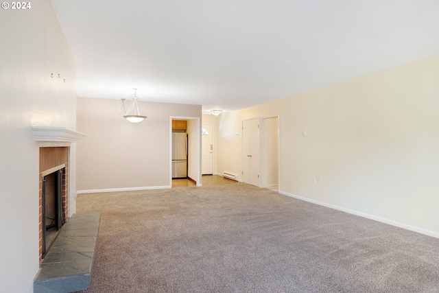 unfurnished living room with a baseboard heating unit and light colored carpet