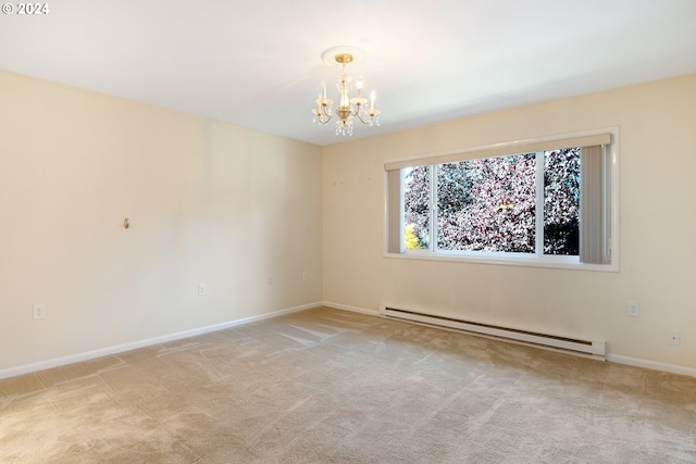 carpeted spare room with a notable chandelier and baseboard heating